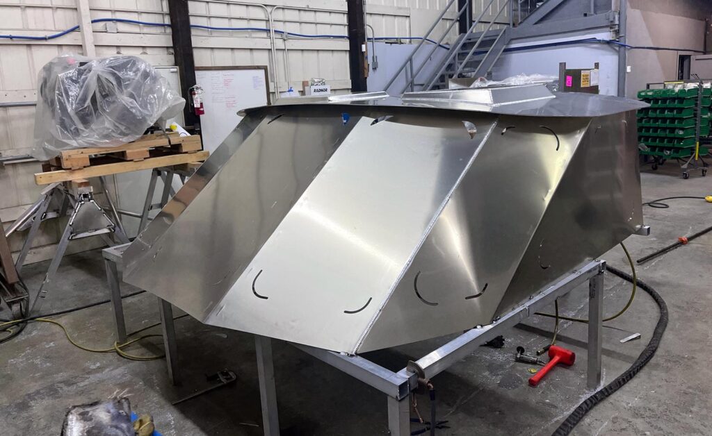 Boat metal fabrication: Skilled craftsman welding and shaping metal components for boat construction