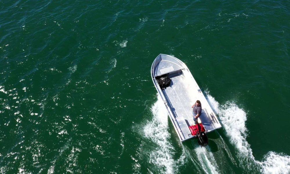 Top down view of our utility skiff boat in the water